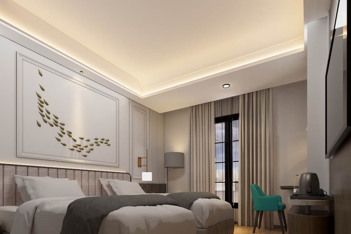 Deluxe Twin Room | Minibar, in-room safe, desk, blackout curtains