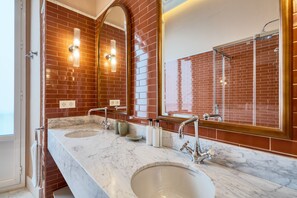Shower, hair dryer, towels, soap