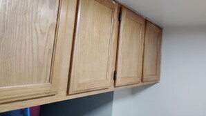 A wooden cabinet with a simple design, likely used for storage in a room. - Charming 1-bedroom apartment in amazing Syracuse with AC and heat (Syracuse)
