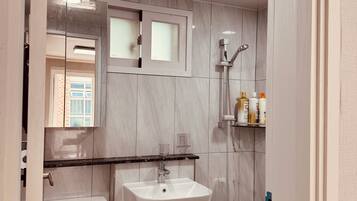 Shower, hair dryer, towels, soap