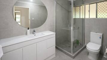 Shower, hair dryer, towels, shampoo