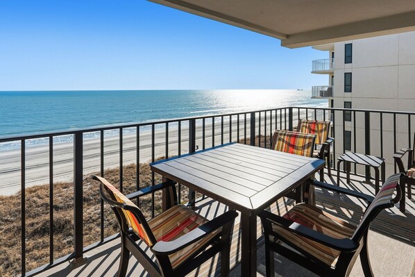 Outdoor dining - Beautiful oceanfront condo w/pool, kids' pool and heavenly private deck for sunrises & sunsets (North Myrtle Beach)