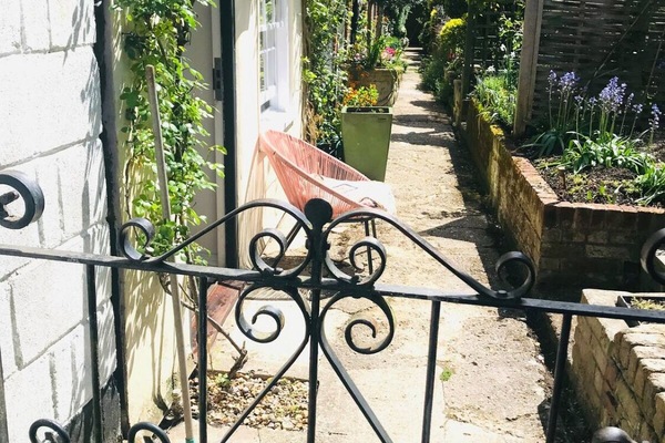 Enter private mews through the private gate, it's the first cottage in the row