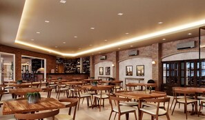 A spacious restaurant with brick walls, wooden tables, and chairs. - Sao Pedro Thermas Resort (São Pedro)