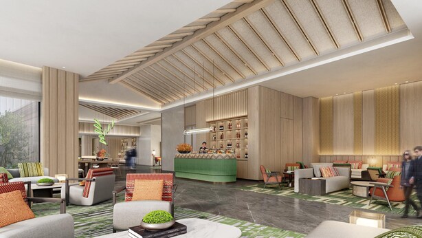 A spacious lobby with a bar area, seating arrangements, and a large window providing natural light. - Holiday Inn Puer Jingmai (Pu'er)