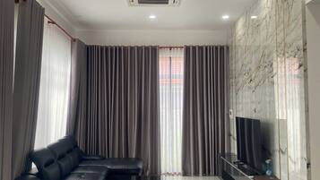 Family Apartment, Resort View | Living area | 30-inch Smart TV with satellite channels