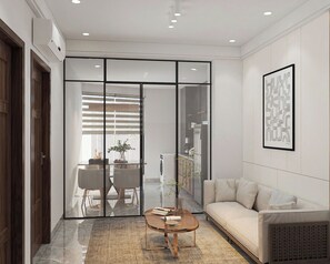 Deluxe King Suite | In-room safe, desk, laptop workspace, blackout drapes