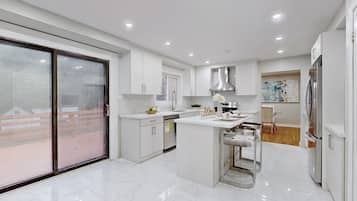 Fridge, microwave, electric kettle, cookware/dishes/utensils