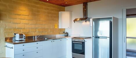 Fridge, oven, toaster, cookware/dishes/utensils