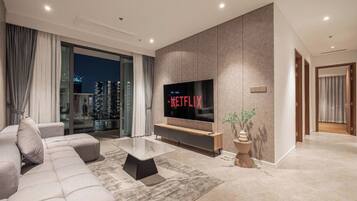 Family Suite, 3 Bedrooms, Club Lounge Access, City View | Living area | 65-inch Smart TV with cable channels, fireplace, Netflix