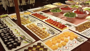 A buffet with various dishes arranged on white plates. - VILLA LYCUS TERMAL OTEL (Denizli)