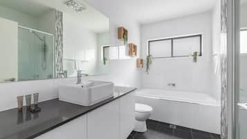 Shower, hair dryer, towels, shampoo