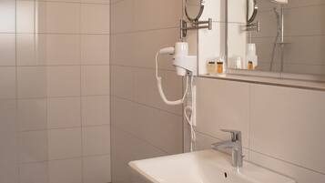 Shower, hair dryer, slippers, towels