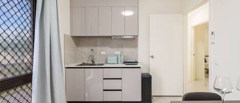 Stovetop, toaster, high chair, cookware/dishes/utensils