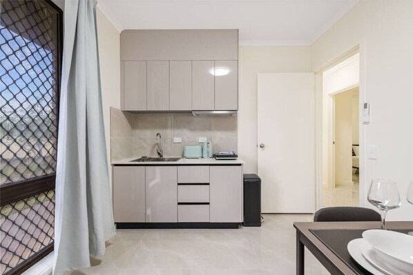 Stovetop, toaster, high chair, cookware/dishes/utensils