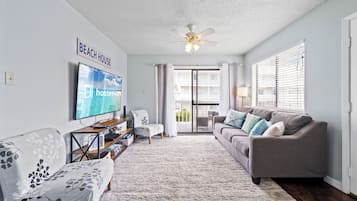 Signature Condo, 2 Bedrooms, Balcony | Living room | 50-inch Smart TV with cable channels