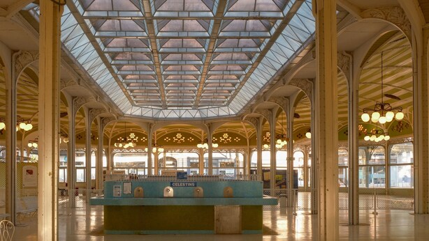 A spacious, ornate hall with a high, glass-domed ceiling and a central counter labeled 'CELESTINS.' - The Originals City Hôtel Harys (Vichy)