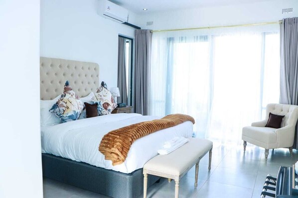 Luxury Suite, Pool View | In-room safe, desk, laptop workspace, blackout curtains