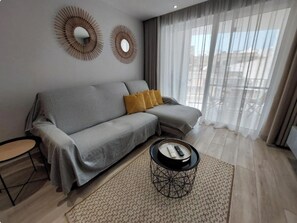 Apartment, 3 Bedrooms, Air conditioning, Beachside | Living area | Flat-screen TV