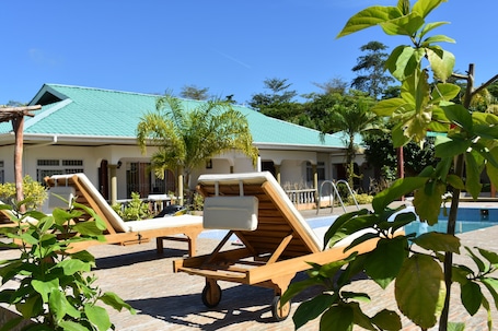 Outdoor pool, open 9:00 AM to 4:00 PM, pool umbrellas, sun loungers