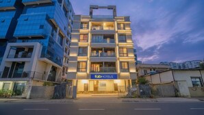A modern building with a sign reading "fabHOTELS" at the entrance. - Fabhotel Destination 41 (Pune)