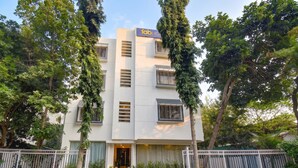 A multi-story building with a sign reading 'fabHO'. - Fabhotel Ans Kp Annex (Pune)
