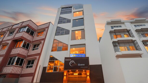 A modern hotel building with a prominent 'Fab Hotels' sign, multiple balconies, and a clear entrance. - Fabhotel Yatri Nivas (Varanasi)