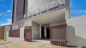 A modern building with a sign reading "KAYAZHA PLAZA". - Fabhotel Kayal Plaza (Coimbatore)