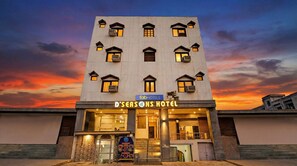 A modern hotel with a flat roof and multiple balconies, featuring a sign for 'D'SEASONS HOTEL' and 'fabHOTELS'. - Fabhotel D Season (Agra)