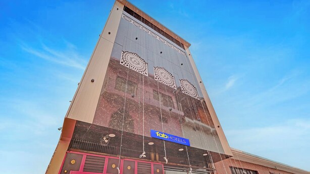 A hotel with a prominent facade, a sign reading 'Tab Hotels,' and a large decorative window. - Via Ayodhya Residency (Ayodhya)