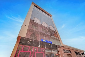 A hotel with a prominent facade, a sign reading 'Tab Hotels,' and a large decorative window. - Via Ayodhya Residency (Ayodhya)