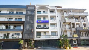 A multi-story hotel with a modern facade, including balconies and a prominent entrance. - Fabhotel Laxmi Mahal (New Delhi)