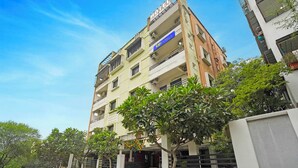 A multi-story hotel with a sign for 'Tab Hotels' and 'Hotel Club Metro'. - Fabhotel Club Metro (Nagpur)