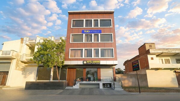 A multi-story building with a sign for 'Fab Hotels' and 'Hotel Sunshine'. - Fabhotel Sunshine Residency I (Jaipur)