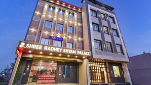 A hotel named Shree Radhey Shyam Palace with a sign indicating it offers both AC and non-AC rooms. - FabHotel Shree Radhey Shyam Palace - 500m Khatushyam Temple Khatoo (Khatoo)