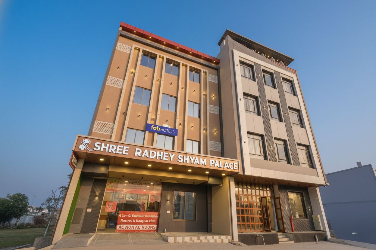 A hotel named Shree Radhey Shyam Palace with a modern facade, multiple floors, and a prominent entrance.