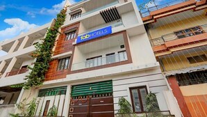 A multi-story hotel with a prominent 'Fab Hotels' sign. - Fabhotel Kashi (Varanasi)