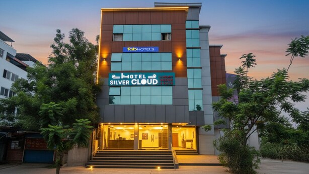 A modern hotel with a prominent sign for 'Hotel Silver Cloud'. - Fabhotel Dsg Residency (Faridabad)