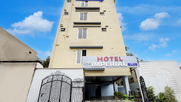 A hotel named "The Imperial Blue" with a signboard and a gated entrance. - Fabhotel Imperial Blue (Nagpur)