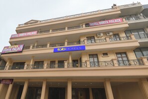 A multi-story hotel with balconies and signage indicating 'Hotel Surya Palace' and 'Fab Hotels'. - Fabhotel Surya Palace 1 (Chandigarh)