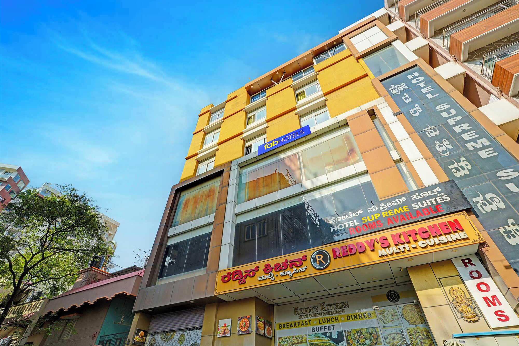 A multi-story building with a prominent 'fab hotels' sign.