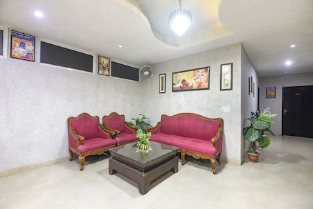 Lobby sitting area. Fabhotel Happy Residency