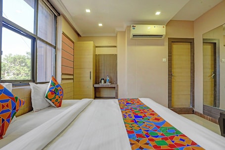 Egyptian cotton sheets, premium bedding, in-room safe, free WiFi. Fabhotel Tanvi Grand
