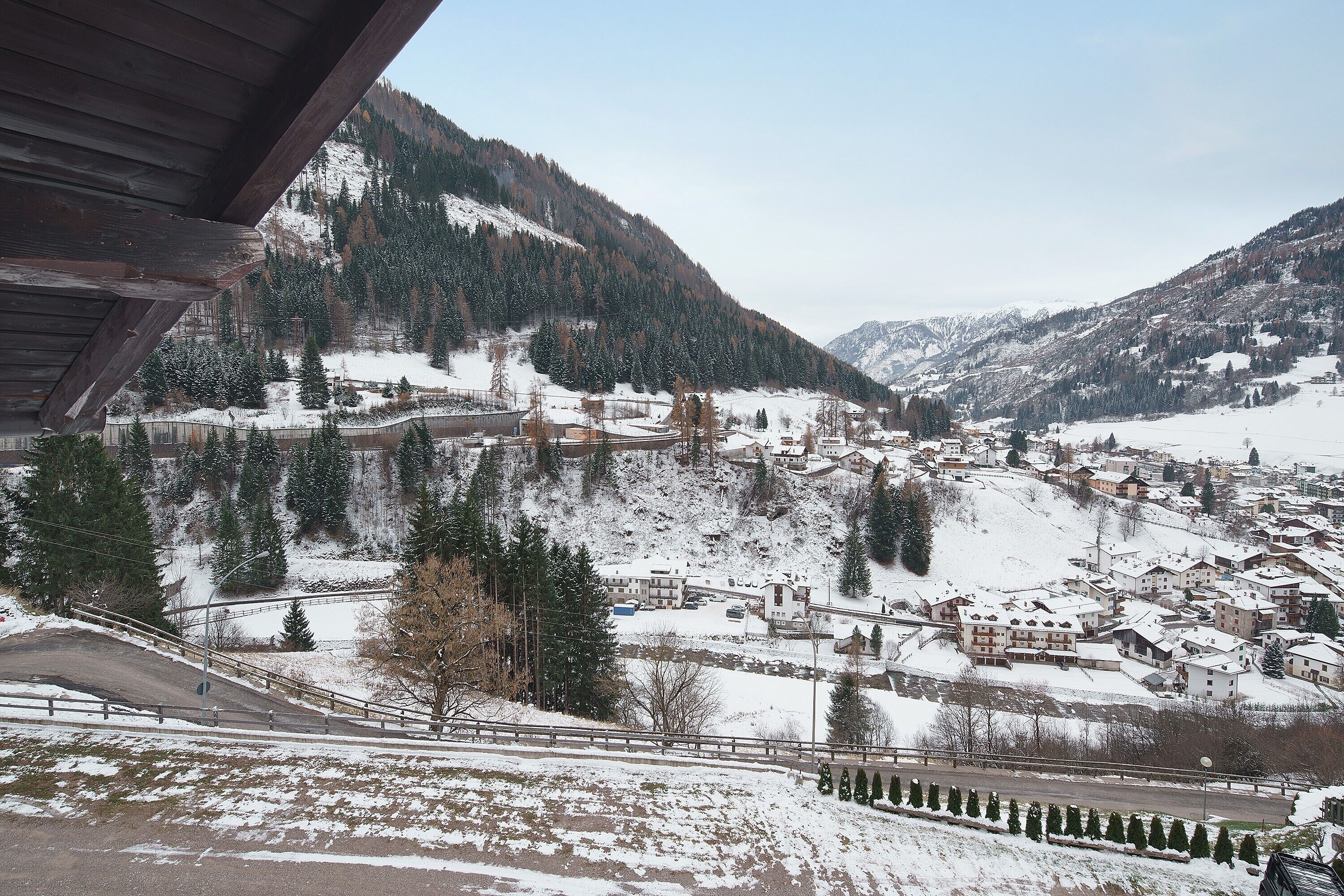 A mountainous town with snow-covered buildings and a clear view of the surrounding landscape.