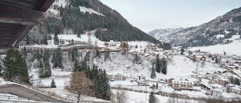 A mountainous town with snow-covered buildings and a clear view of the surrounding landscape.