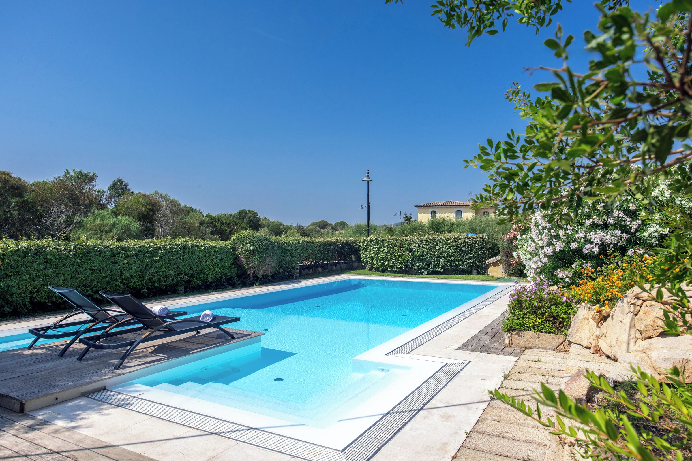 Seasonal outdoor pool, open 10:00 AM to 7:00 PM, pool loungers