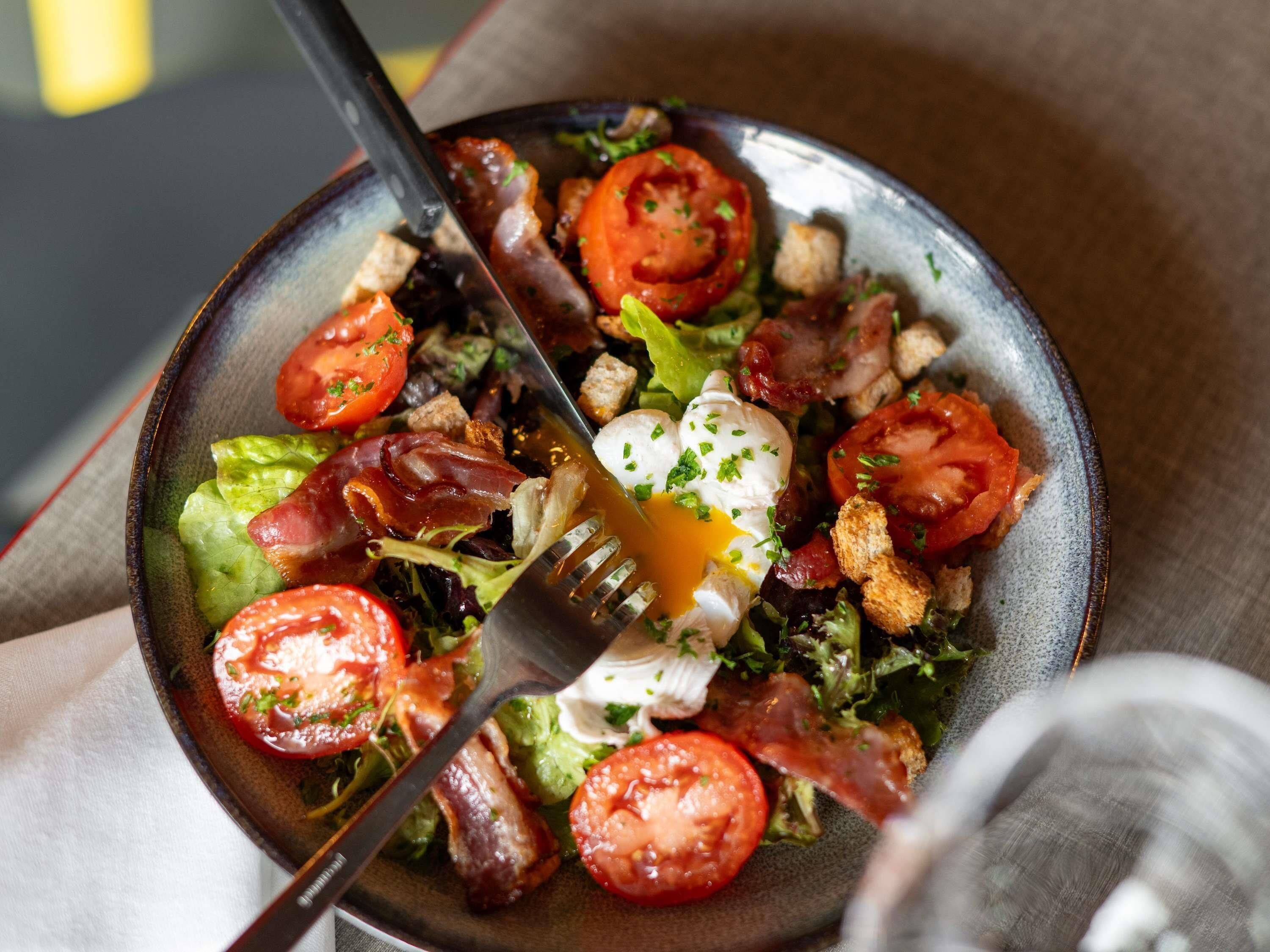 A plate of food with a fork.