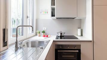 Apartment (1 Bedroom) | Private kitchen | Oven, espresso maker, electric kettle, highchair