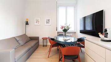 Apartment (1 Bedroom) | Living area | 32-inch TV with cable channels