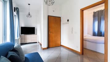 Apartment, 1 Bedroom | Living area | 30-inch TV with satellite channels